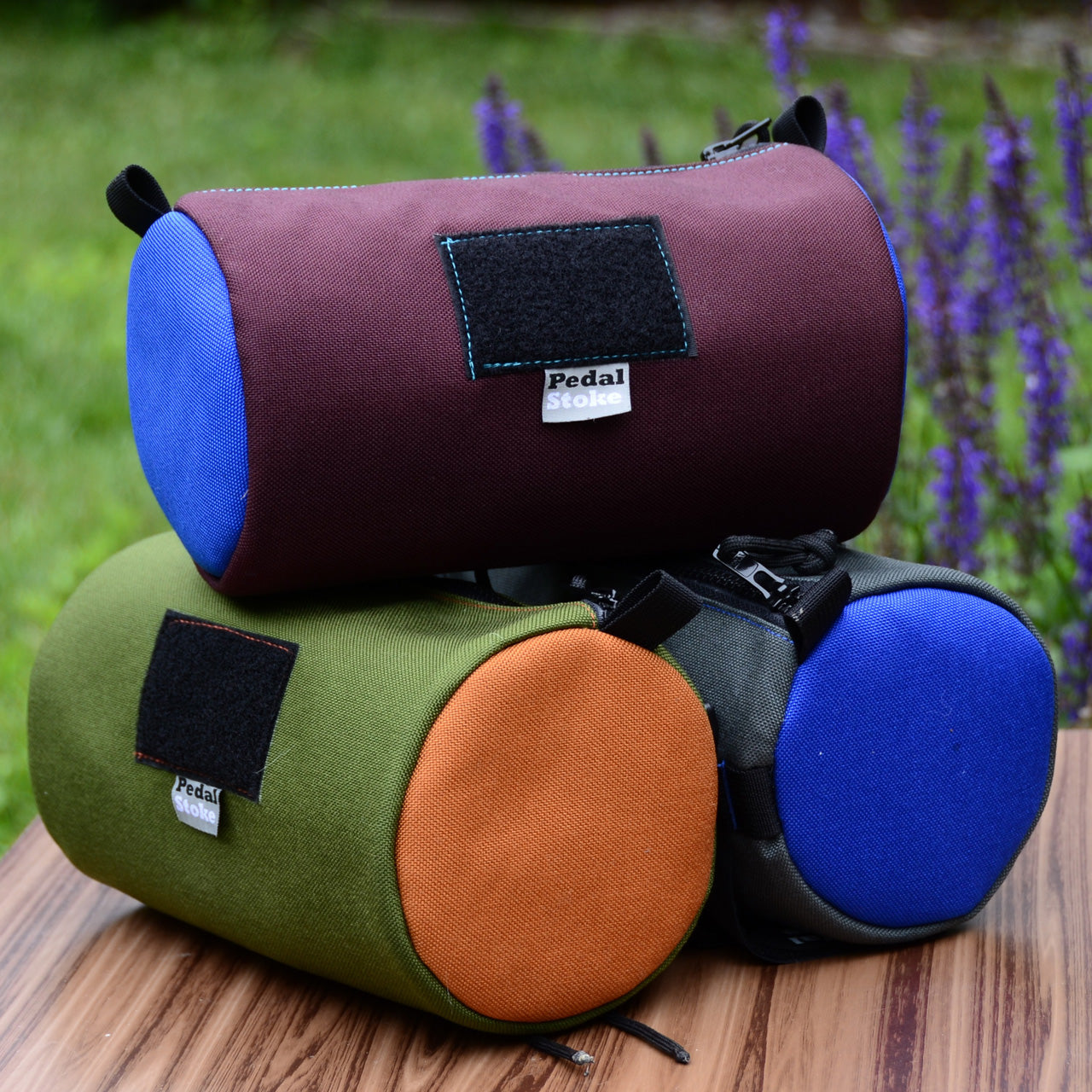 colorful stack of pedal stoke burrito bags for bike frames